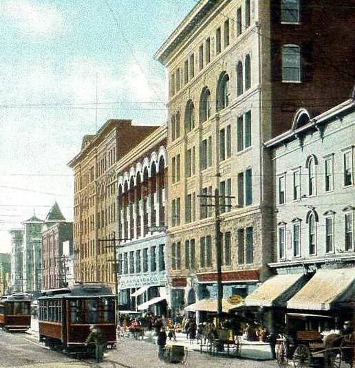 Vintage view from the southeast along Main Street with the Dowlin Block to the right