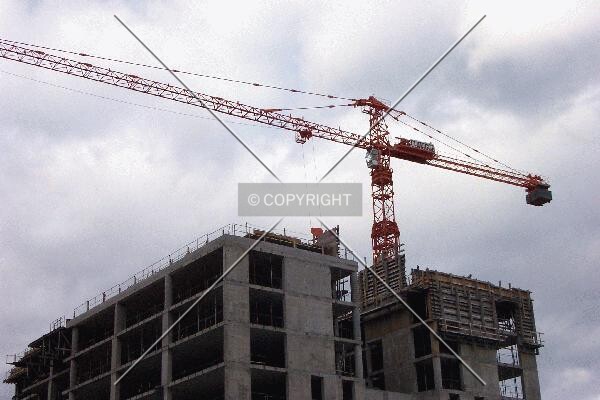 The crane continues to work, even on overcast days