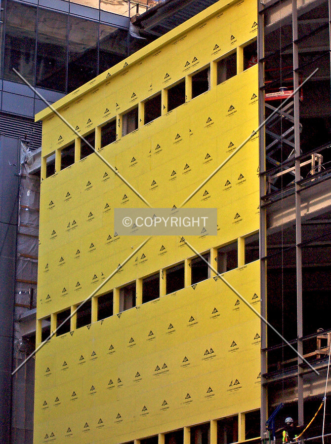 Wall sheathing on the Washington Street facade of the retail podium