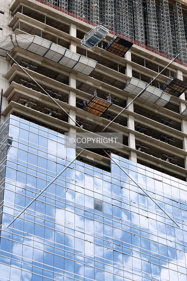 The curtain wall rises