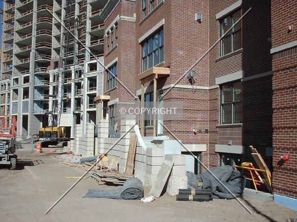 Entrances to Grant Street townhomes, Tower rising behind
