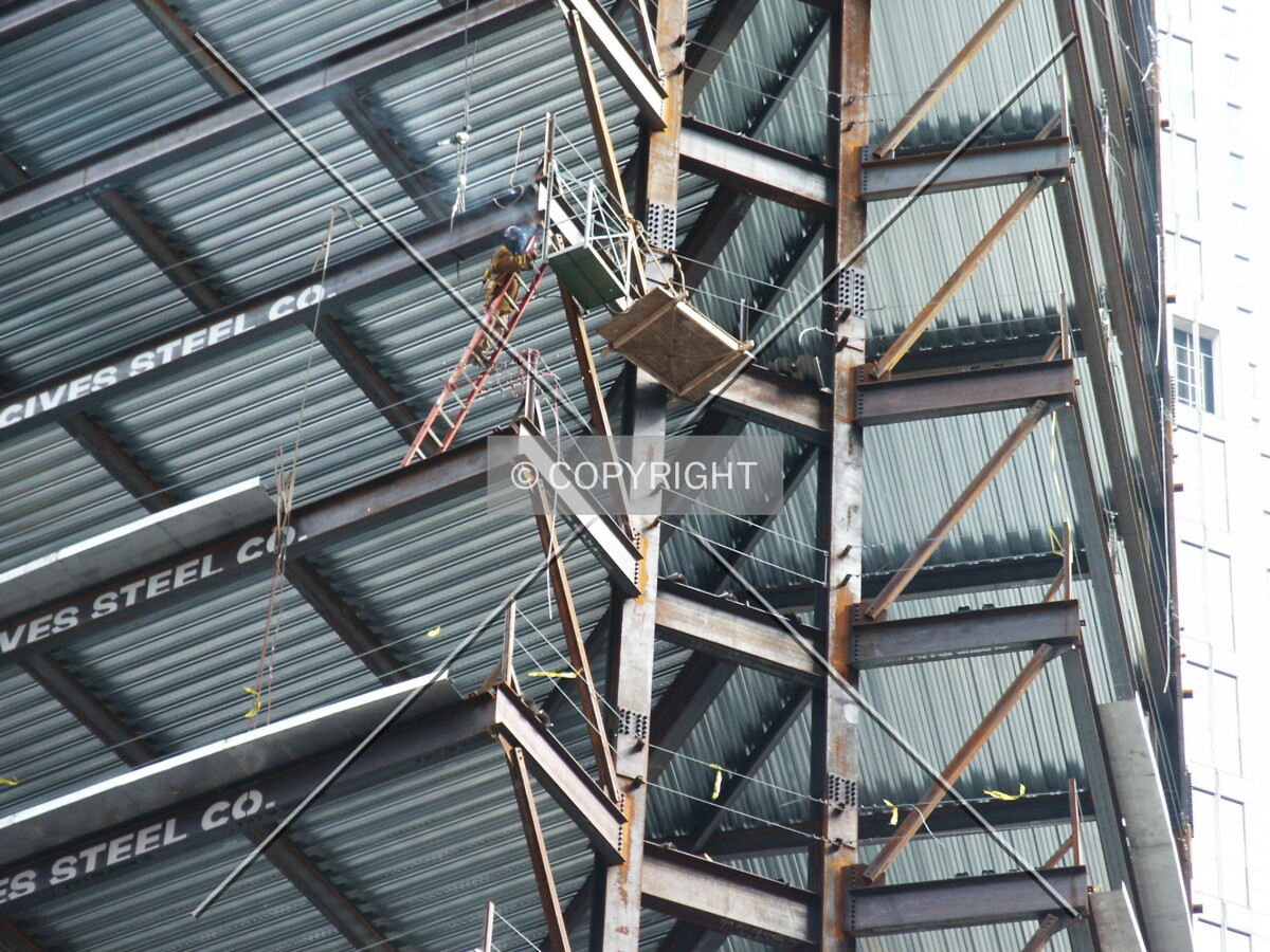 Steelworkers at the western point of the structure