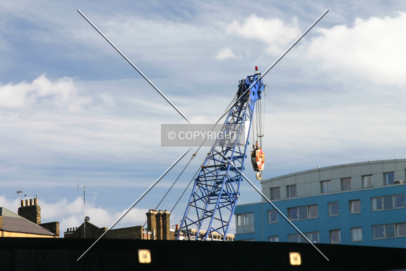 A crane rises over the site