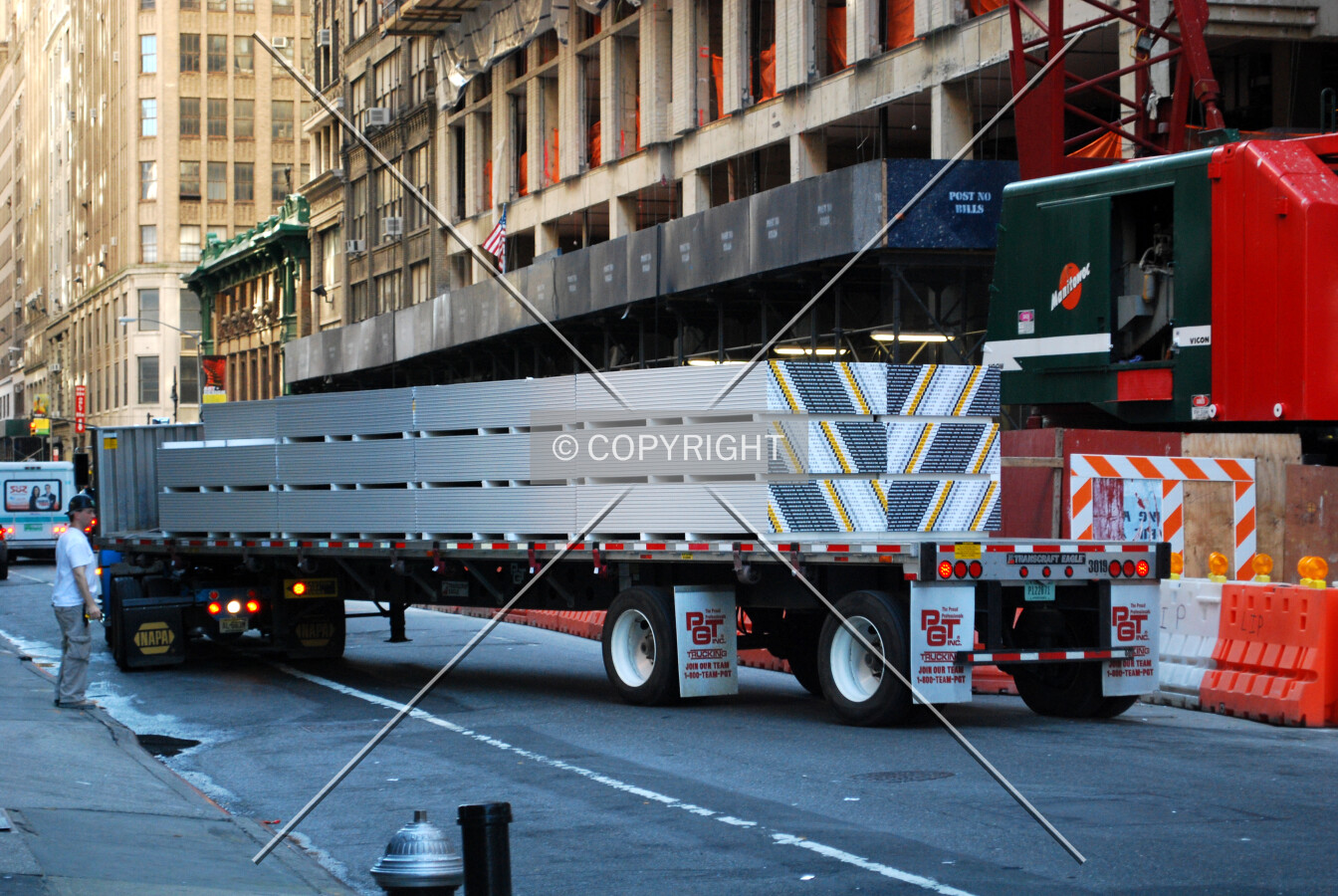 Sheetrock arriving at the site