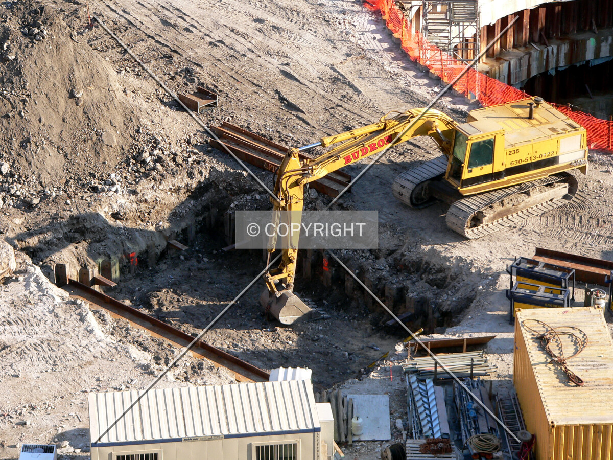Excavating the tops of two mega caissons to place caps on them