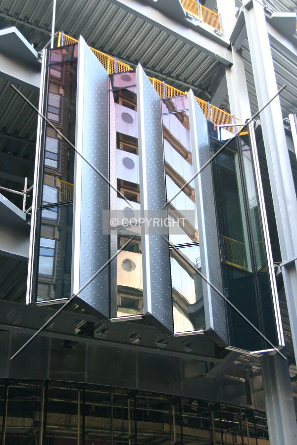Installation of the ridged façade on the Fenchurch Avenue side showing reflections of The Lloyds Building's lavatories
