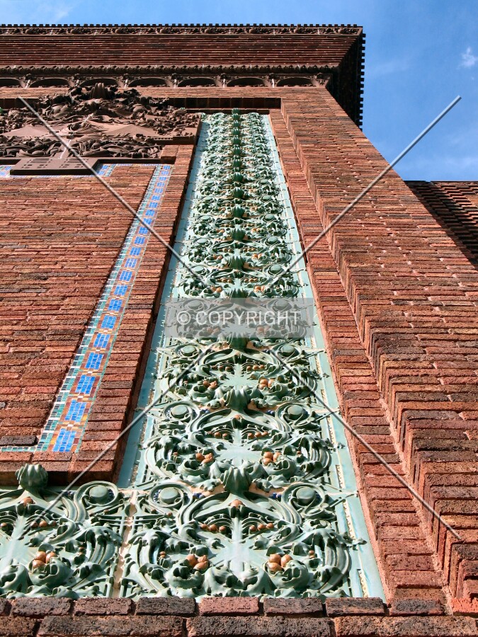 Looking up at the green terra cotta trim