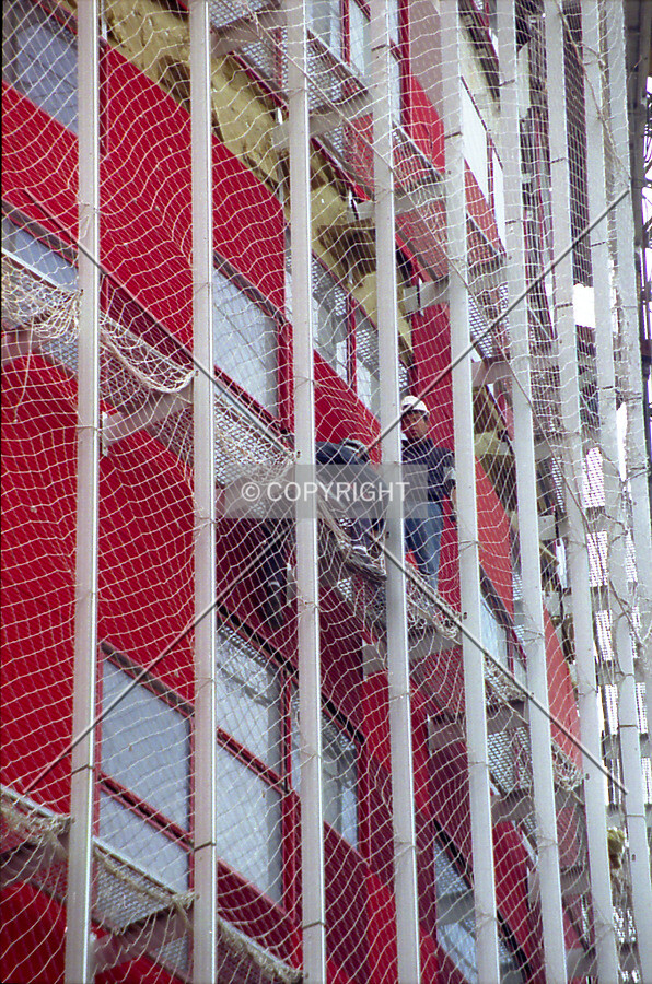 Worker on steel skybridge