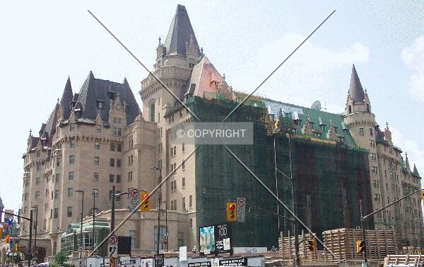 Building undergoing retrofit on July 7th, 2003. View from corner of Rideau St. & Sussex St.