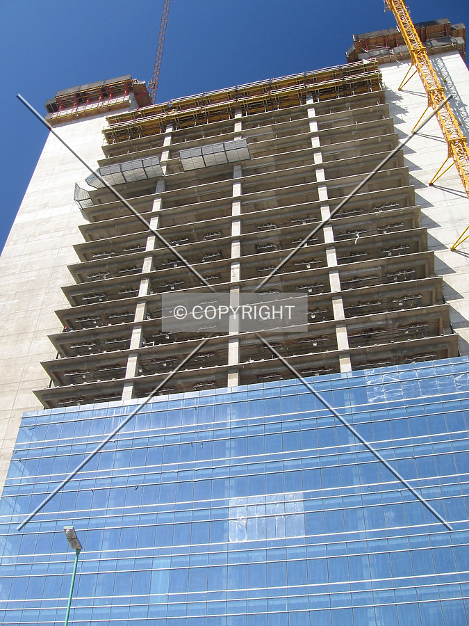 The curtain wall rises