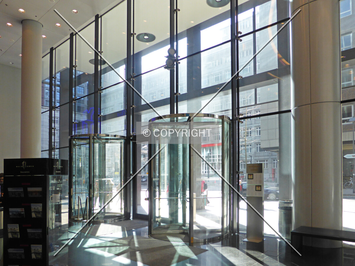 Glass revolving doors in the lobby of the visitors area