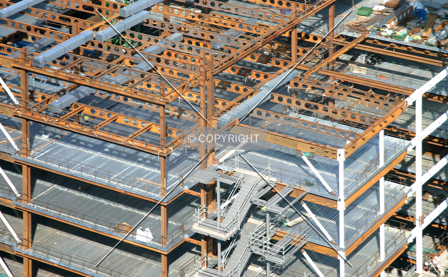 View northwest looking down at the framework and decking from the 25th floor of 125 Old Broad Street
