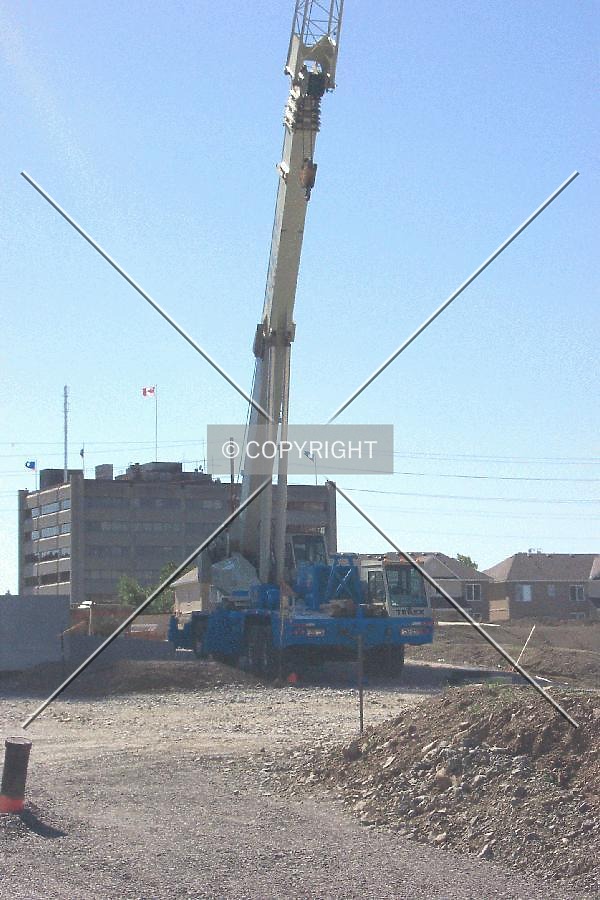 Remote crane, parked near the entrance of the constructions site