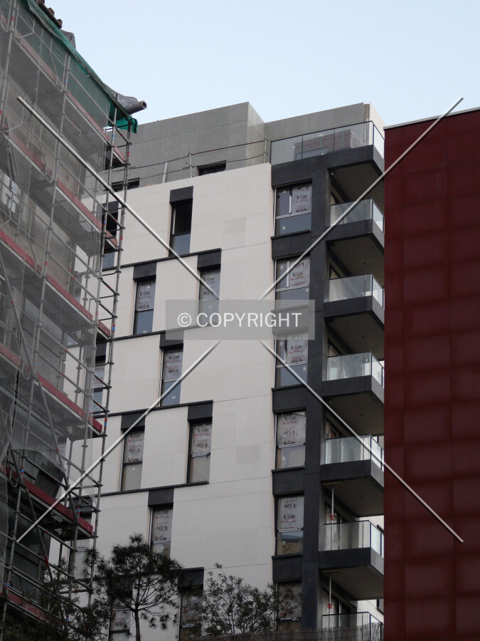 Northwest side as seen from between the neighboring buildings