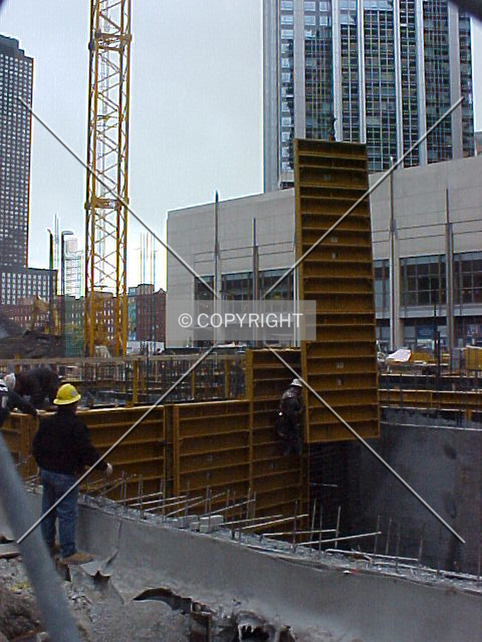 Construction workers putting formwork into place