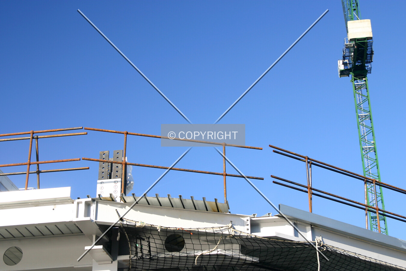 Looking up from the Thames Embankment at the southernmost extremity of the first floor's steelwork showing decking waiting to be cut