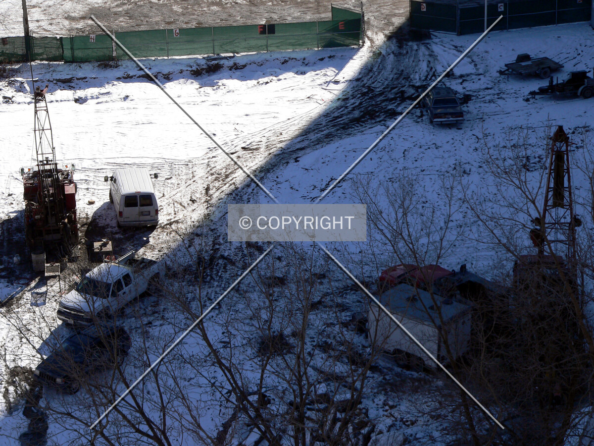 Soil testing trucks in the northwest corner of the site