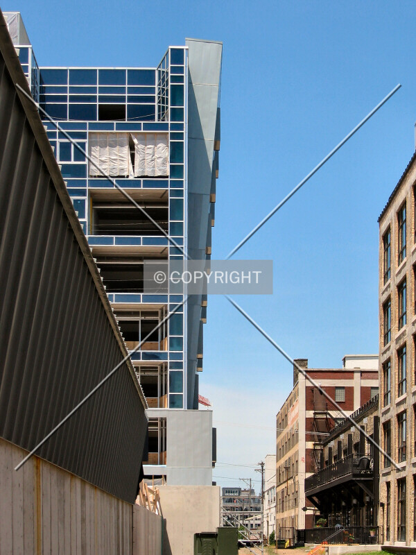 Leaning toward the neighboring Bookmen Lofts, from the driveway next to the garage entrance
