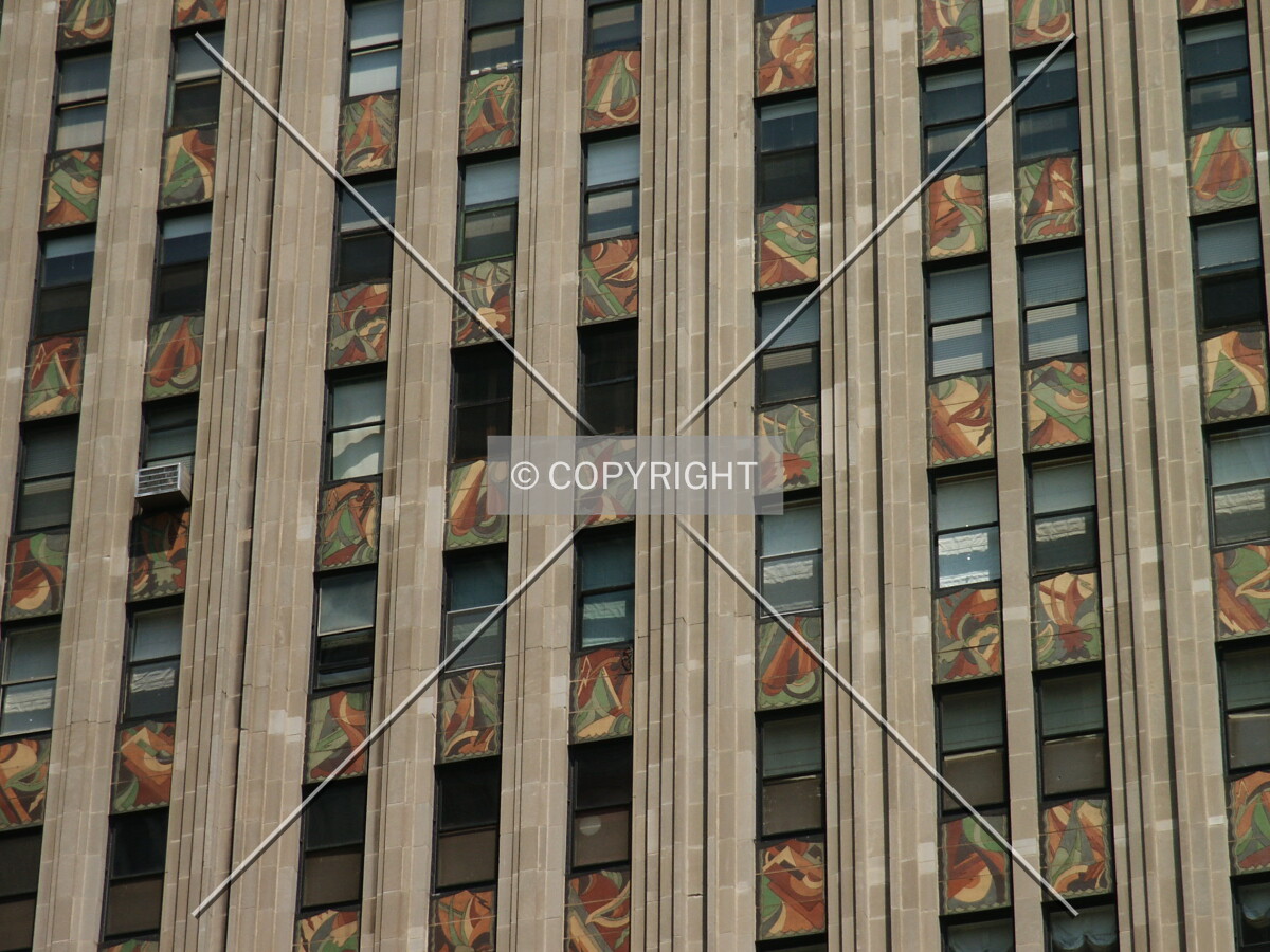 Windows with art deco spandrels in between
