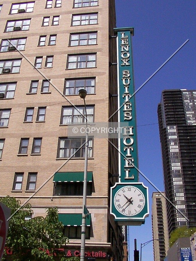 Sign and clock at the northeast corner