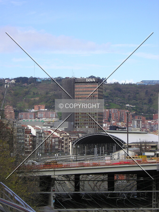 Distant view of the tower, with the Abando Central train station and the Cantalojas buildings in between