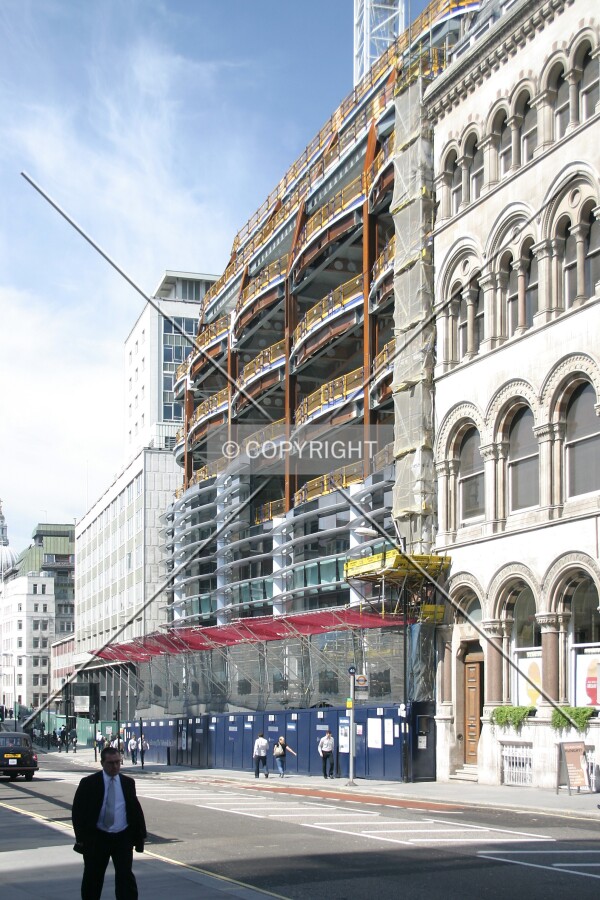 View west from Cannon Street of façade installation progress on the south side