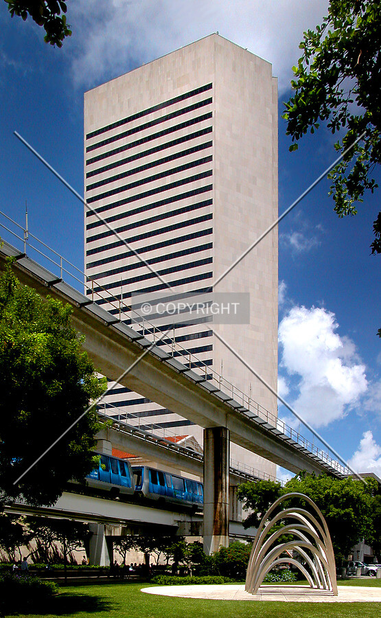 From the north with park sculpture and passing monorail train