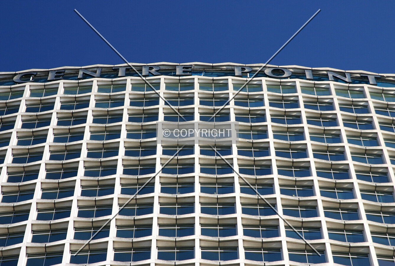 Looking up to the signage atop the west side from Charing Cross Road