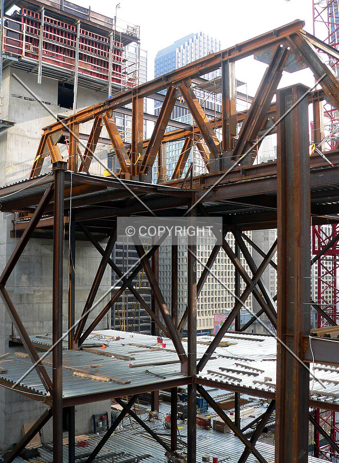View to the southwest through a truss and structural supports
