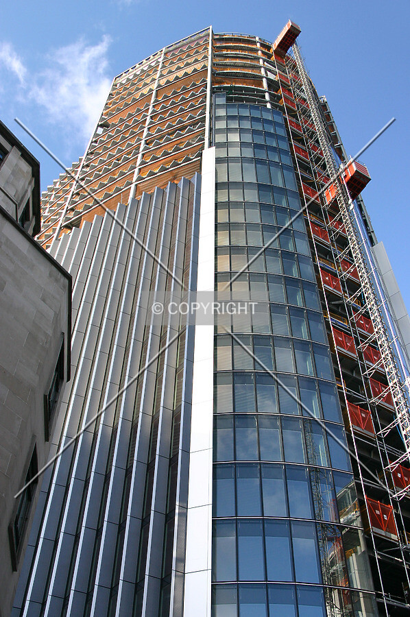 Looking up the southeast corner at façade installation progress