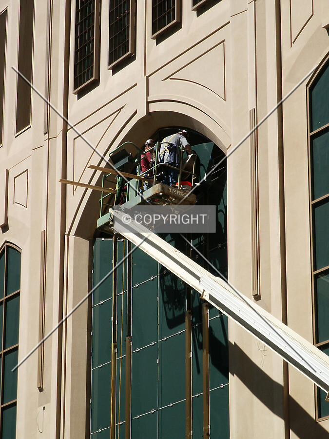 Installing the upper right pane in the central window above the entrance