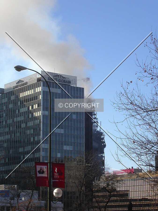 Smoke rising from the heap of debris