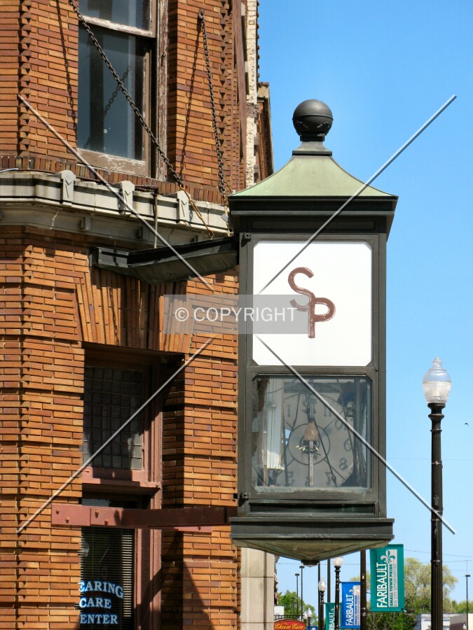 Massive clock at corner; no longer functional