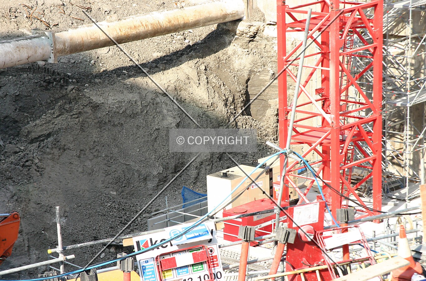 Elevated view into the pit from the CityPoint walkway showing the base of the crane on erection day