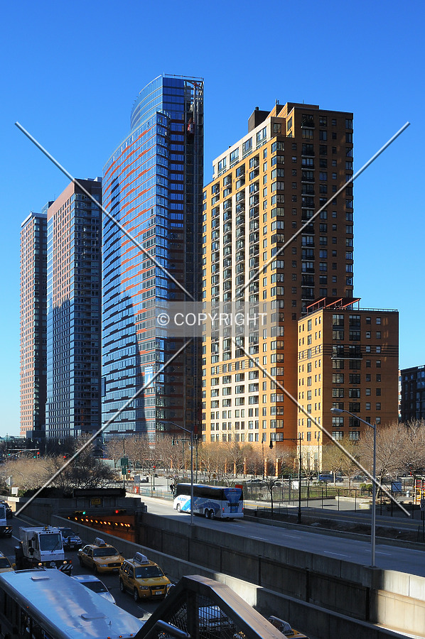 The Visionaire in the middle, between other residential high-rise buildings