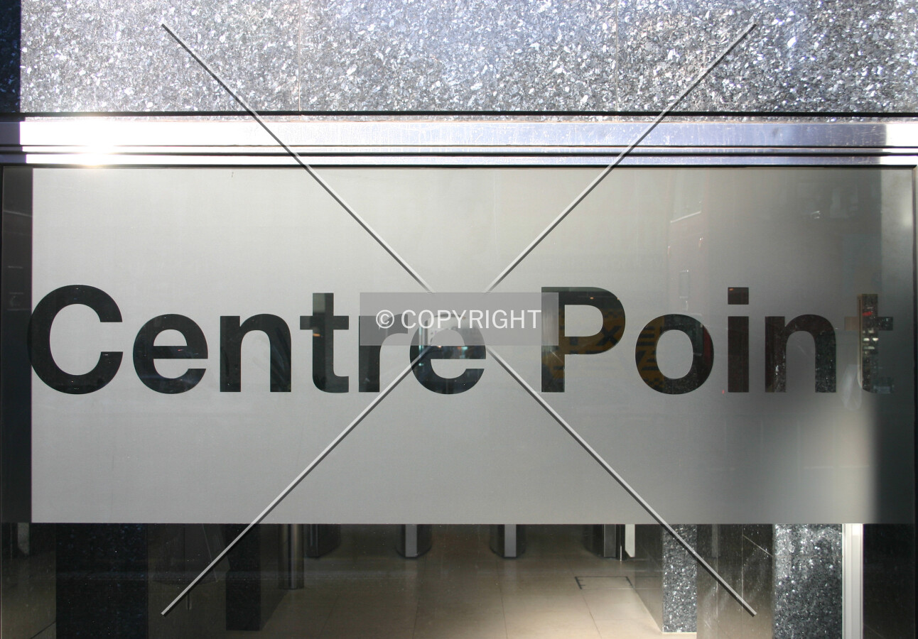 Modern glass signage on the base of the south side