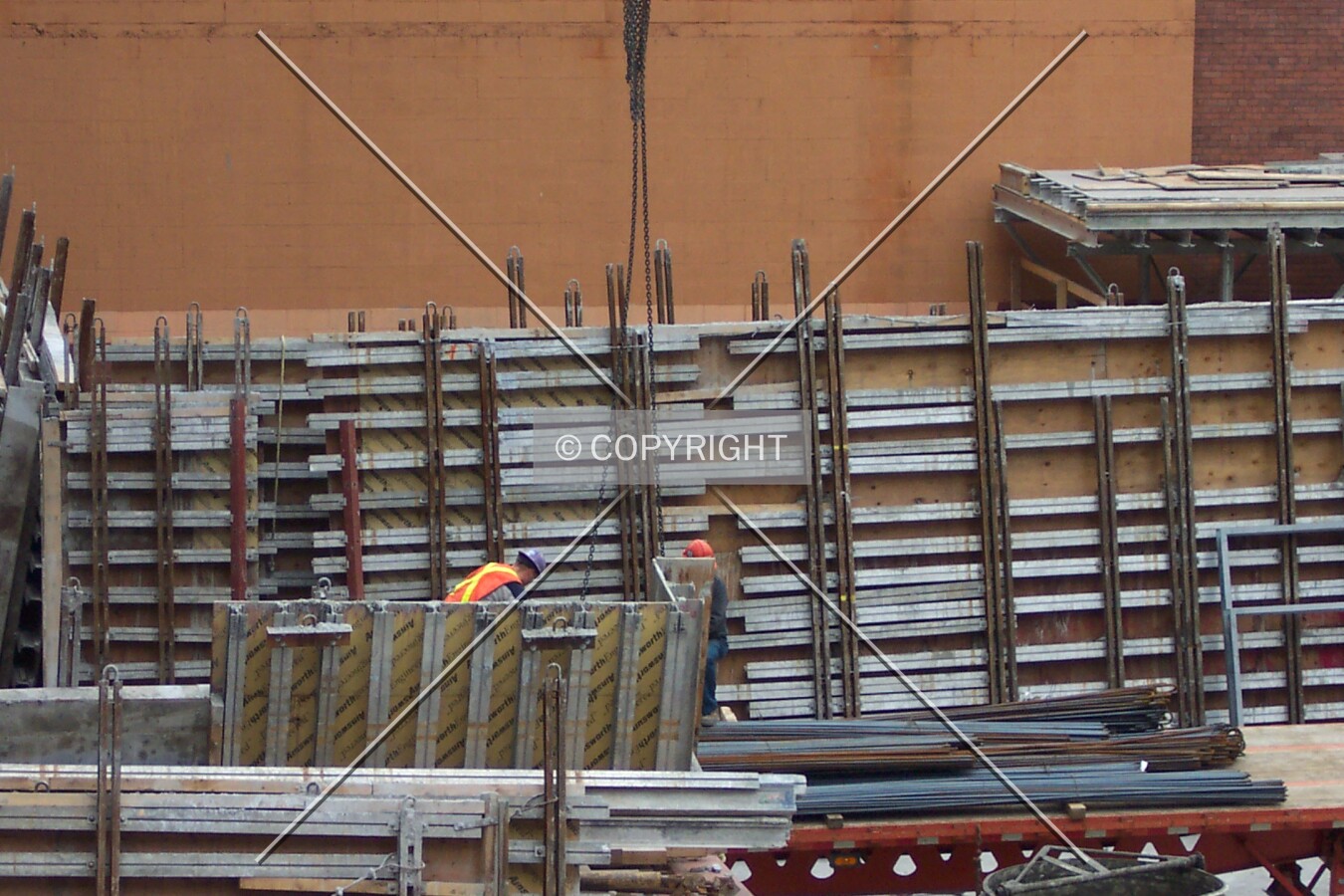Loading pre-assembled wall mounts onto the crane