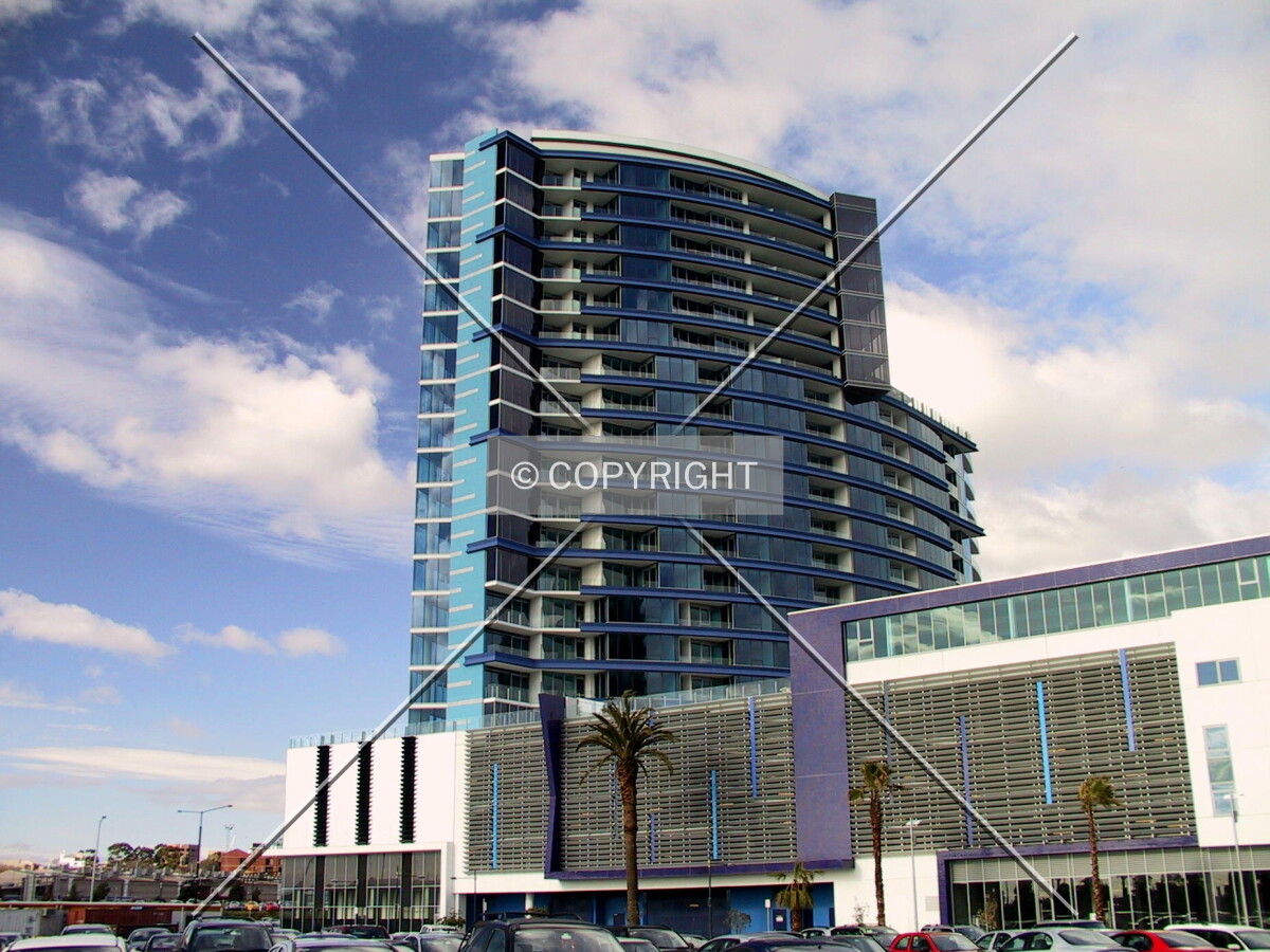 View of the tower and the rear of the podium apartments