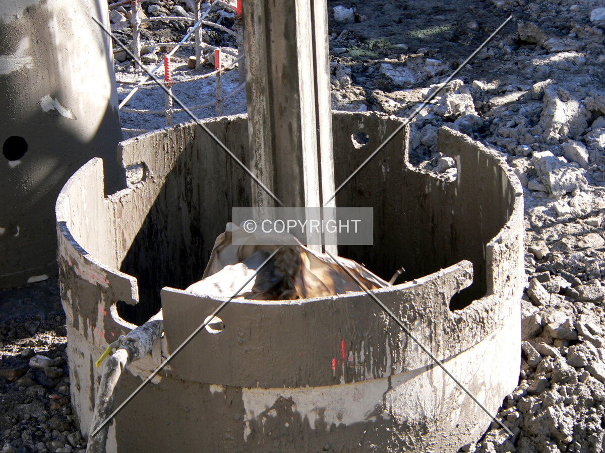 Slurry mix being poured down a caisson hole