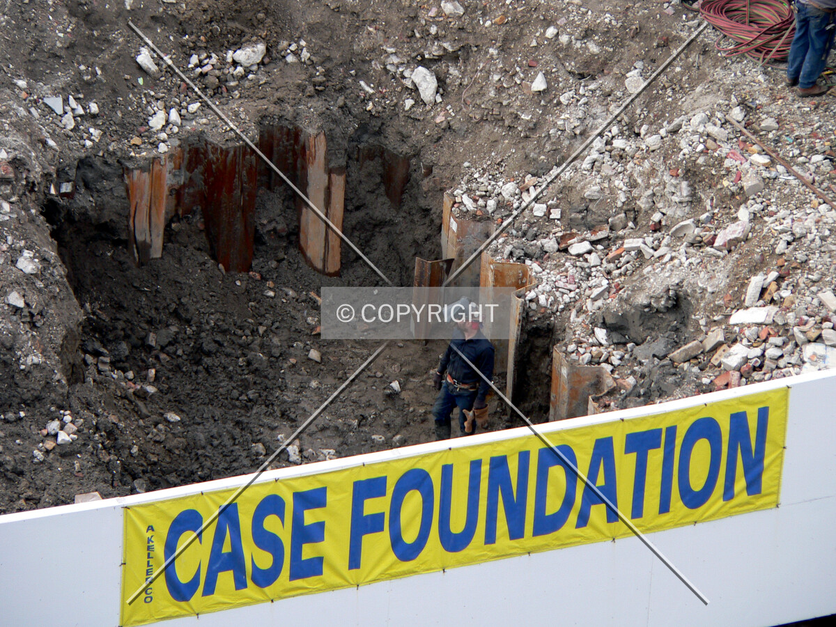 Digging out the tops of caissons along Ogden Slip