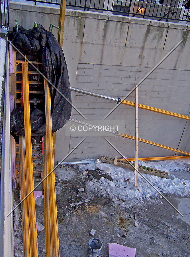 Concrete column curing inside formwork, located in the northwest corner of the site, adjacent to the Swissotel and 303 East Wacker