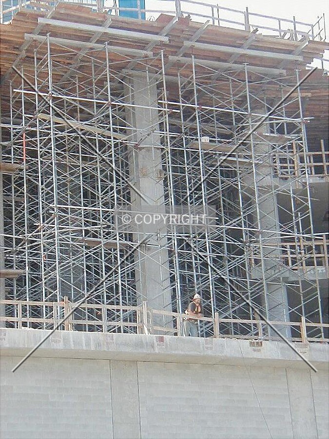 Scaffolding and worker on a Saturday
