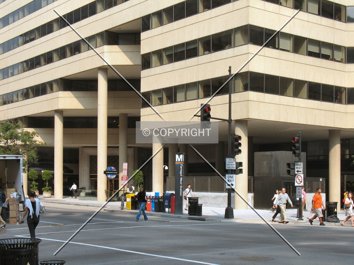 Base of the southeast corner, with the 18th Street entrance to the Farragut West Metro Station
