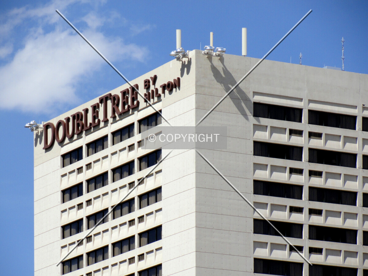 Upper floors and signage from the southwest