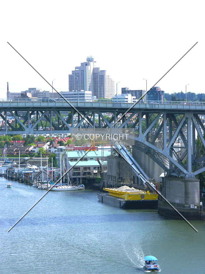 Hospital tower in distance rises above the Granville Bridge