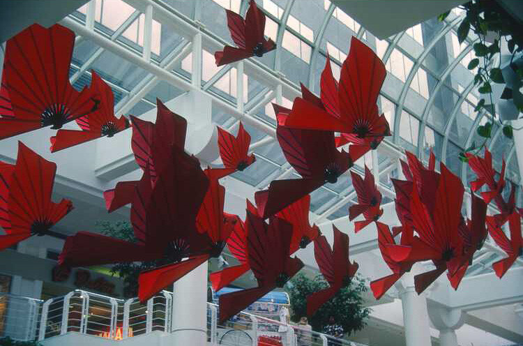 Stylized bird flags hung from mall ceiling