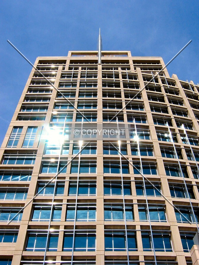 Looking up from West Washington Street, reflecting the desert sun