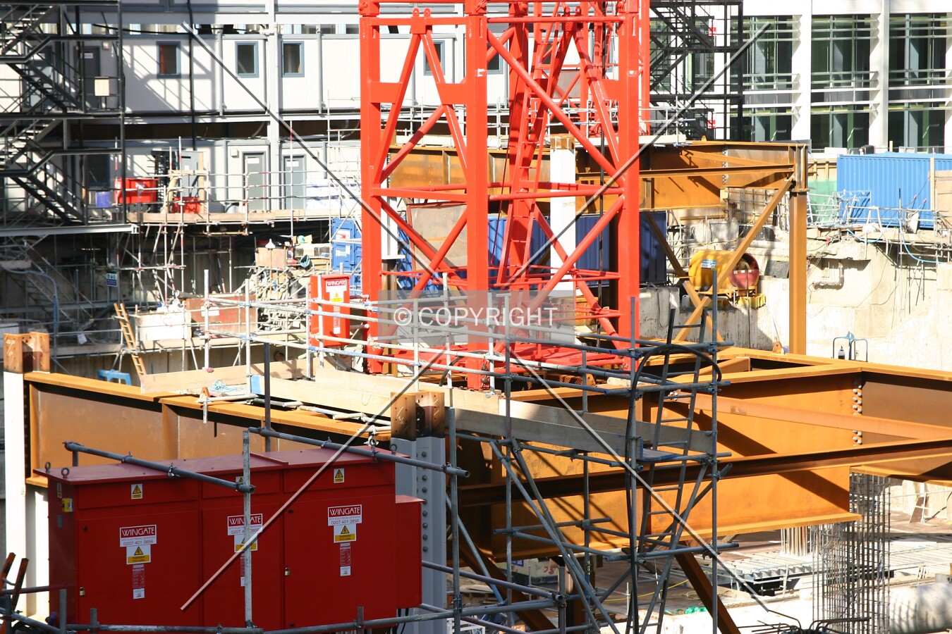 Elevated view towards the base of a crane from Milton Court Walk