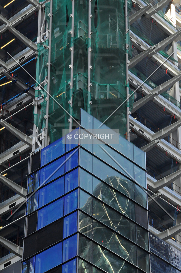 Facade installation on the southwest corner and a reflection of 30 St Mary Axe