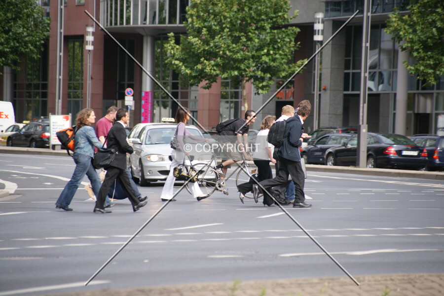 A crowd is crossing the street